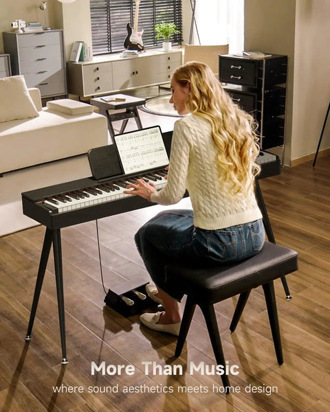 Woman playing OURA S100 88 Key Graded Hammer Action Digital Piano With Bluetooth in modern living room setting