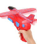 Person holding a hand launched foam airplane toy for backyard fun easy throw glider with safe soft foam aerodynamic body in red.