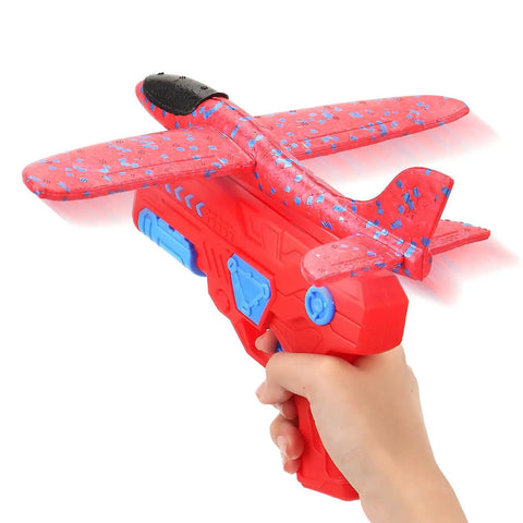 Person holding a hand launched foam airplane toy for backyard fun easy throw glider with safe soft foam aerodynamic body in red.