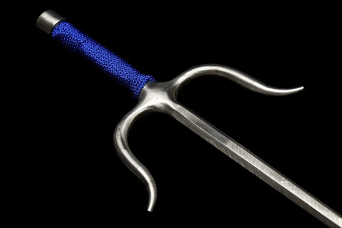 Close-up of Pro Grade Kobudo Sais made from stainless steel with octagonal blue string grip, side view of handle and blade.