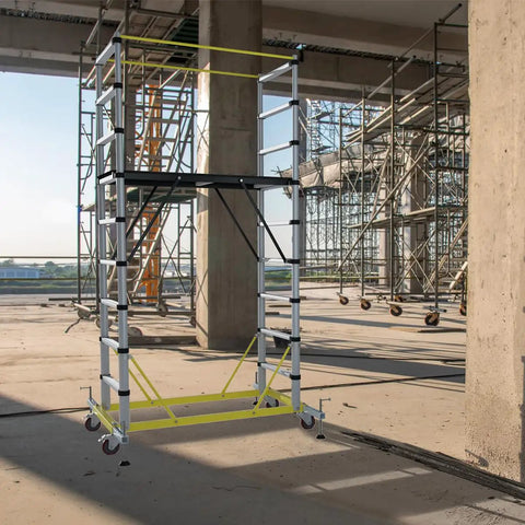 Heavy Duty Aluminum Scaffold Tower Ready To Roll Work Platform Adjustable Utility Scaffolding With Hatch Deck And Guard Rail 500 Pounds Capacity in a construction site.