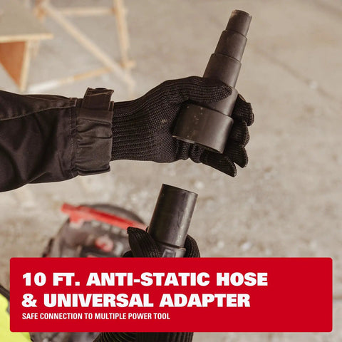 Gloved hands holding the 10 ft. anti-static hose and universal adapter for Dual-Mode Wet Dry Vacuum With Auto Tool Activation.