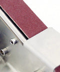 Close-up of the sanding belt for Heavy Duty Mini Belt Sander Featuring Hella Fast Seven Speed Settings And Rock Solid 15 Degree Fixed Angle.