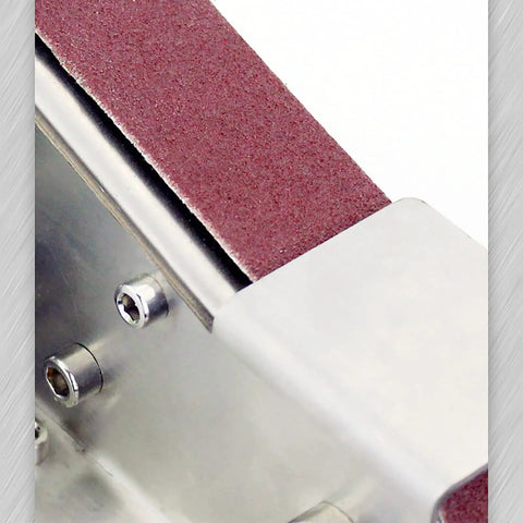 Close-up of the sanding belt for Heavy Duty Mini Belt Sander Featuring Hella Fast Seven Speed Settings And Rock Solid 15 Degree Fixed Angle.