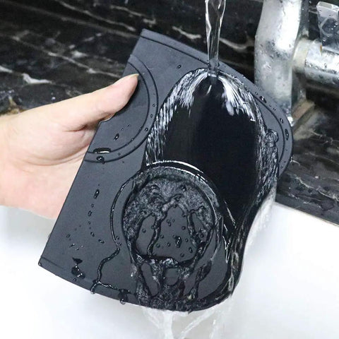 Espresso Tamper Mat For Home Barista Setup, Food Safe Silicone Coffee Tamp Pad With Anti Slip Surface being rinsed under water