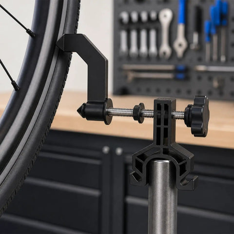 Slick Portable Bike Wheel Truing Stand, Precision Spoke Adjuster for MTB and Road Cycles, close-up of wheel clamp detail.
