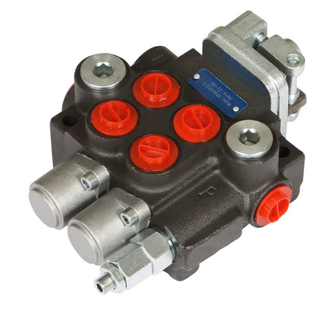 Front view of a two-spool hydraulic directional control valve manifold with red port caps and SAE fittings.