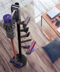 Sturdy Floor Storage Stand With Five Hooks For V Series Cordless Vacuum Cleaners Boss Level Docking Station Organizer Bracket Keeps V15 Detect V11 V10 V8 V7 V6 Neatly Parked In Black, shown in a living room setting.