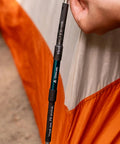 Close-up of Tent Pole Repair Kit 4 Piece Field Kit For Aluminum Or Fiberglass Poles with heat-activated sleeve in use on tent.