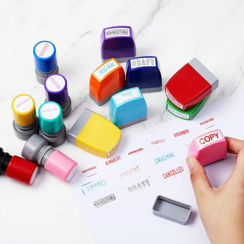Top Shelf Fourteen Piece Self Inking Office Stamp Set Featuring Slick Business Message Designs For Approved Paid Copy Faxed And Scanned Papers That Make Desk Work Go With Zero Sweat, showcasing colorful stamps on a desk.