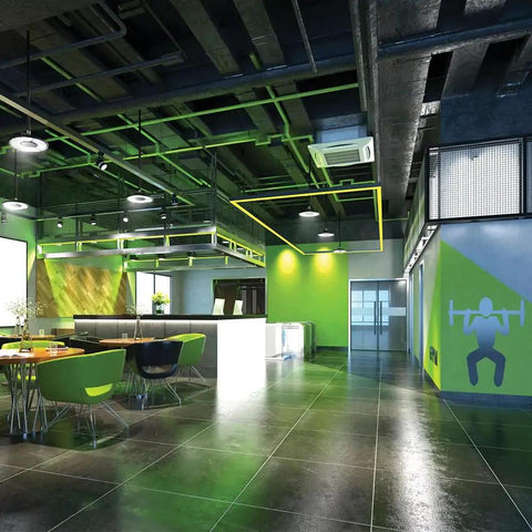 Modern interior with Compact Pro Round LED High Bay Light for garages and warehouses, sleek design, vibrant colors