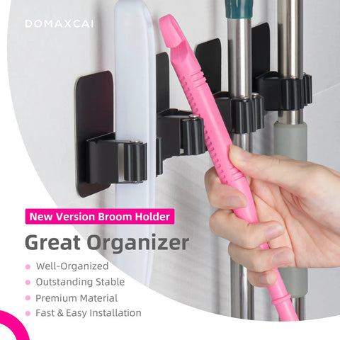 4 Pack Wall Mount Broom And Mop Holder Set With Ultra Anti Slip Grippers For Kitchen, Bathroom, Closet, Garden And Garage No Drilling Needed Space Saving Organizer Black, showing multiple tools held securely.