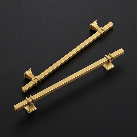 Level Up Your Home With These Slick Gold Cabinet Pulls Packed In A 30 Pack Set With 8 Inch Center To Center Spacing Crafted From Heavy Duty Stainless Steel Perfect For Kitchen Islands And Bathroom Vanity Updates. Two gold cabinet pulls on a black background.