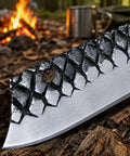 Close-up of Cowboy Style Fixed Blade Knife with Resin Handle for Camping, Ranch Work, and Hunting, against campfire backdrop