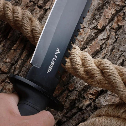 Close-up of Survival Knife With Sheath 15 Inch Fixed Blade Bowie cutting rope, textured blade against wood.