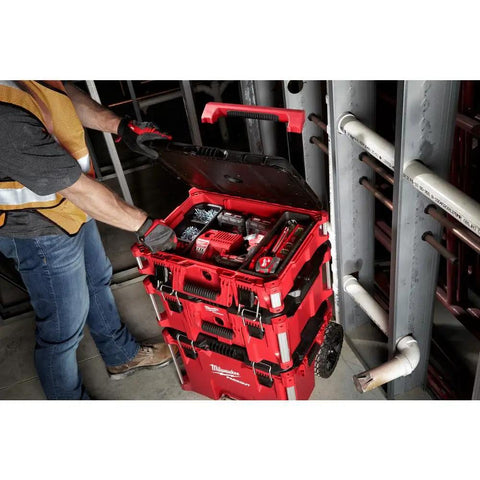 Worker using Packout 22 Inch Tool Box With Heavy Duty Latches And Interior Organizer Trays Durable Modular Storage System For Tools