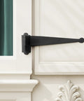 Pack Of 4 Black Offset Strap Lift Off Pintle Hinges Built To Last 11 Inch By Two And Five Eighths Inch Wrought Iron Pin Hinges For Shutters Exterior Doors Or Gates Heavy Duty Hardware With Rust Resistant Powder Coat Finish shown on white door