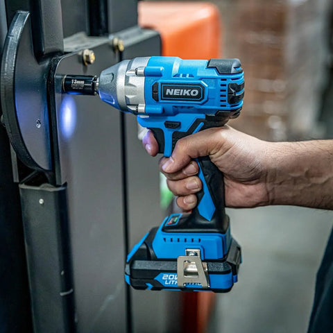 Person using 3 8 Inch Drive Brushless Cordless Impact Wrench 20 Volt Compact Workhorse With Lithium Ion Battery And Fast Charger