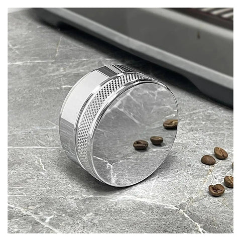 Prime Pick 58Mm Espresso Coffee Distributor And Adjustable Palm Tamper Stainless Steel core resting on a marble surface with coffee beans.