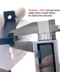 Measuring Ten Sets Heavy Duty 2020 Aluminum Extrusion Corner Bracket thickness in a caliper for 20 Series V Slot Hardware L Angle Connector.