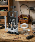 Portable Electric Wire Stripper Machine With Hand Crank Wire Peeler Tool Ideal For Scrap Copper Recycling on a workbench.