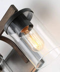 Close-up of bulb and clear glass shade on Rustic Faux Wood Three Light Farmhouse Vanity Light With Distressed Black Backing