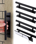 4 Pack Self Adhesive Cabinet Handles and Drawer Pulls in Black ABS Plastic with White Adhesive Strips shown on wood panel.