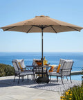 9Ft Patio Umbrella With Base Included For Outdoor Deck And Poolside Relaxation 8 Sturdy Ribs Waterproof Fade Resistant Tan Polyester Canopy Easy Setup Base Up To 80 Lbs Of Sand Ideal For Backyard Lawn Garden over dining table by poolside