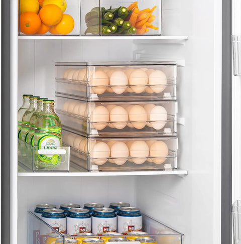 24 Egg Storage Organizer For Fridge, BPA Free Stackable Egg Holder, Clear Egg Drawer shown in a filled fridge