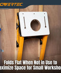 Heavy Duty Folding Router Table Stand With Adjustable Height Workstation Base For Trim Routers wall-mounted in a small workshop.