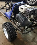 Go Kart Live Axle Bearing Kit 1 1/4 Inch 3 Hole Design installed on go kart frame with visible tires and engine