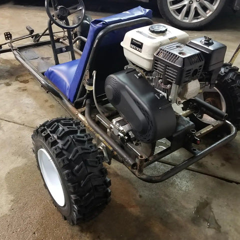 Go Kart Live Axle Bearing Kit 1 1/4 Inch 3 Hole Design installed on go kart frame with visible tires and engine