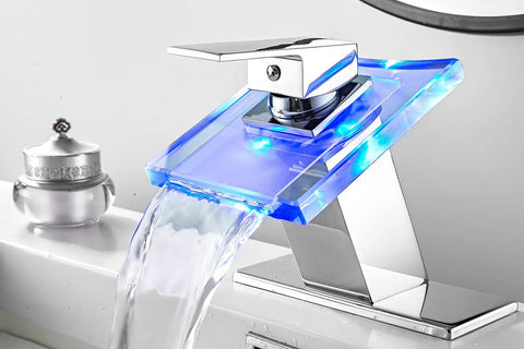 Waterfall Glass Spout LED Temperature Changing Bathroom Faucet With Single Handle Deck Mounted Cold Warm Hot Water Mixer Chrome Finish Four Color Modes And Temperature Warning Light with blue LED glowing.