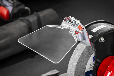 Workhorse 150Mm Bench Grinder Equipped With A Beefy 450W Induction Motor safety spark shield and 150mm grinding stone close-up.