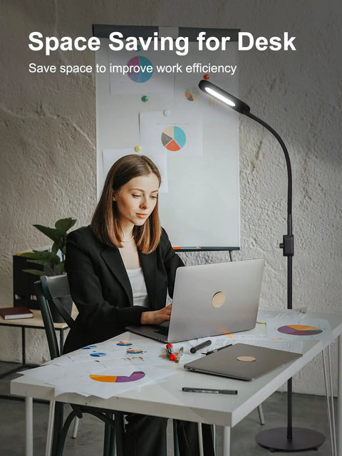 Office desk with a Go-To Floor Lamp With Stepless Dimmer And 3 Color Temperature Modes, adjustable gooseneck providing focused light.