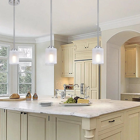 Two Pack Brushed Nickel Pendant Lights With White Linen Glass Shades above a modern kitchen island