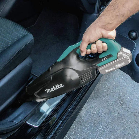 Cordless Vacuum For Workshop And Home, 18V LXT Tool Only, shown cleaning car interior, ergonomic design in use.