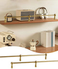 Rock Solid Brass Floating Shelf Rails Kit With Two End Posts And One Through Post, shown on wooden shelves with decor.