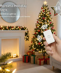 Person using Wireless Remote Outlet Switch Kit With 656 Foot Range No Wiring Required Pre Programmed for holiday lights