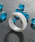 Hella Durable Smart Zirconia Ceramic Key Ring For Tesla Model 3 Y X S Cybertruck on textured surface with blue beads.