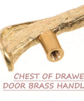 Close-up of vintage brass drawer handle with bird motif, solid brass construction for cabinets and cupboards