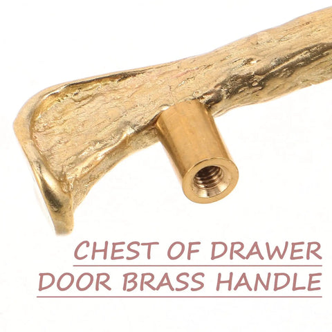 Close-up of vintage brass drawer handle with bird motif, solid brass construction for cabinets and cupboards