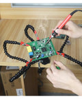 Helping Hands Soldering Tool With Flexible Gooseneck Arms 360 Degree Alligator Clips PCB Vise in use on wooden desk