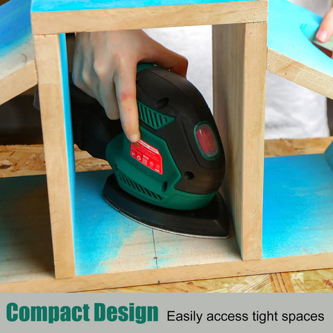 Person using Compact Electric Detail Sander With 14,000 OPM inside a small wooden structure, showcasing easy access to tight spaces.