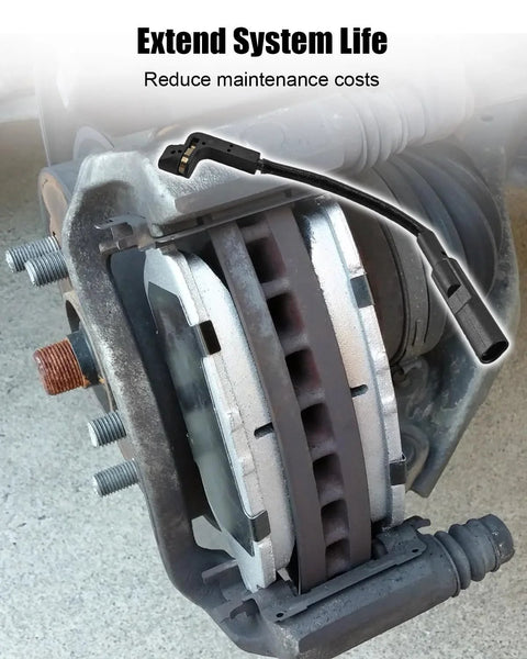 Front brake pad wear sensor with black wiring harness attached to a silver brake caliper and rotor