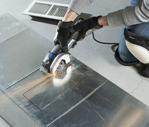 User operating Ultra Saw Corded Compact Saw Tool Kit with 3 Cutting Wheels on a metal surface for precise flush cutting