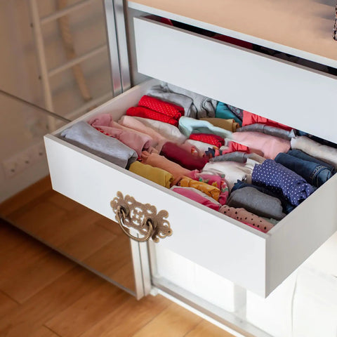 Open drawer with old school brass drawer pulls set 2 antique cabinet handles on white dresser displaying folded clothes