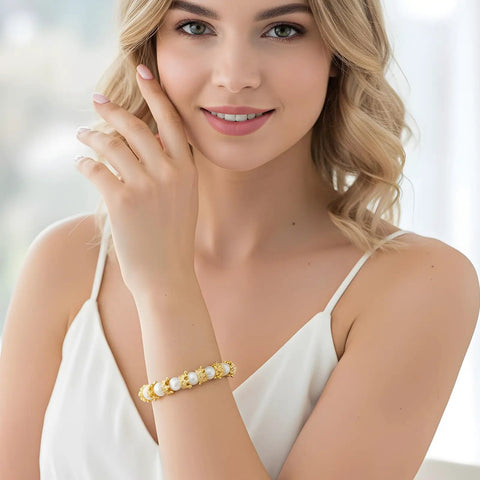 Woman wearing bracelet with Mini Crown Charms For Crafts 3D Gold King Crown Beads With Large Hole For DIY Jewelry Necklace And Bracelet Making 100Pcs Royal Bling Beads For Creative Projects