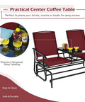 Two Person Swing Glider Chair With Center Tempered Glass Table in Burgundy with fruit and drinks displayed on the table.