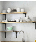 Heavy Duty L Shaped Corner Wall Mount Shelf Brackets With Thickened Steel Build For Floating Industrial Storage That Handle Load Like No Sweat And Bring Major Clean Vibes To Your Space In Black supporting wooden shelves with kitchenware.